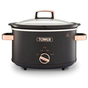Black slow cooker with rose gold handles.
